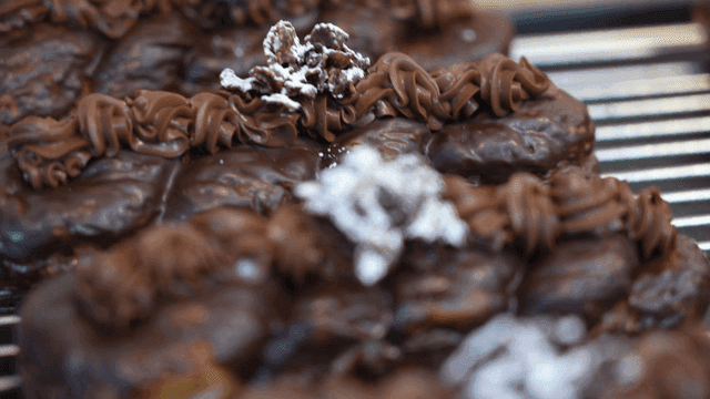 Chocolate-covered pastries with icing
