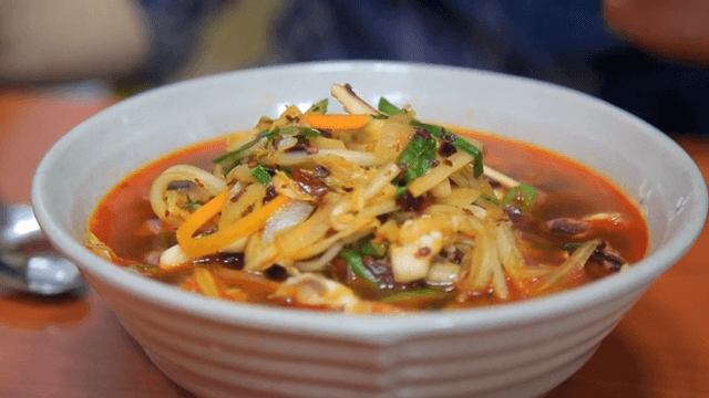Spicy seafood noodle soup with vegetables and seafood