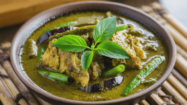 Bowl of Thai green curry with vegetables