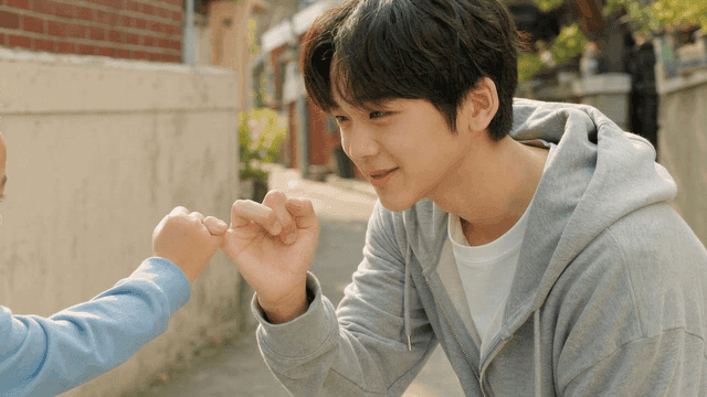 Teenager making promise with child in alley