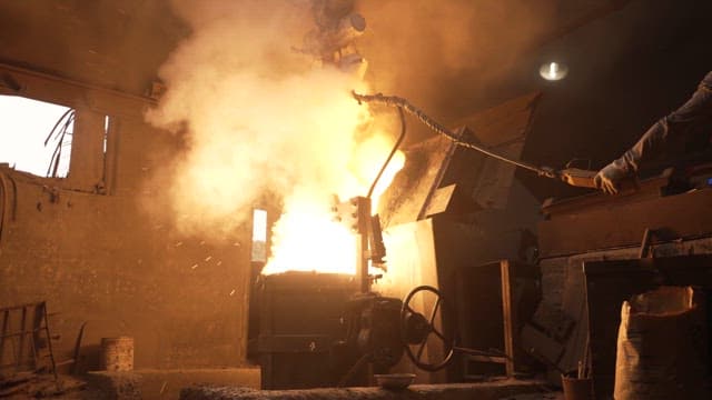 Molten metal being poured in a foundry