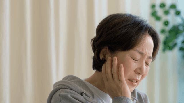 Woman suffering from toothache