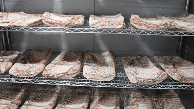 Meat aging on refrigerator shelf