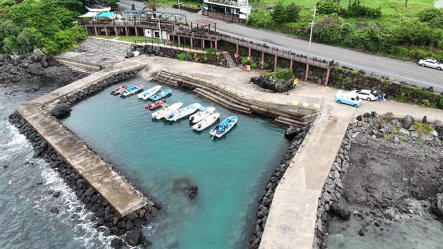 Small harbor and rocky coast with boats