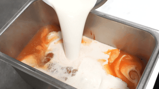 Whipped cream poured into tomato sauce