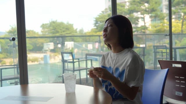 Woman relaxing with a drink at a cafe