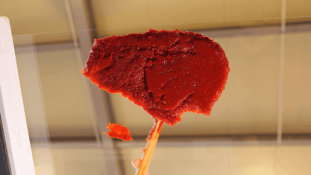 Sight of applying red pepper paste to glass