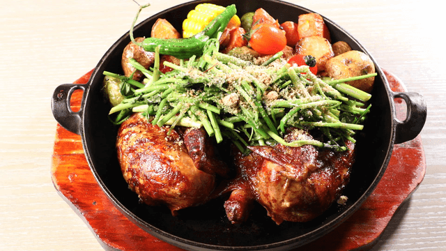 Roasted chicken with vegetables on a pan