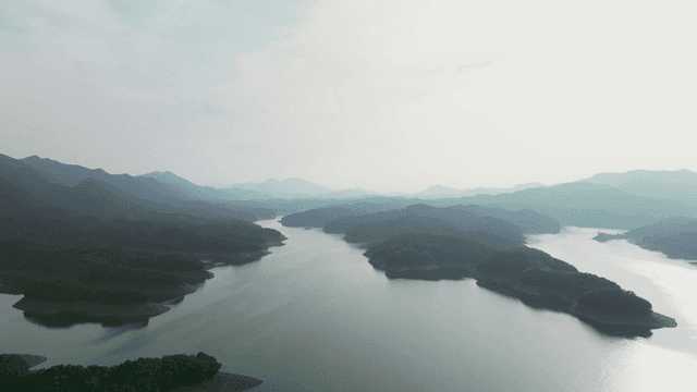Tranquil lake surrounded by mountains