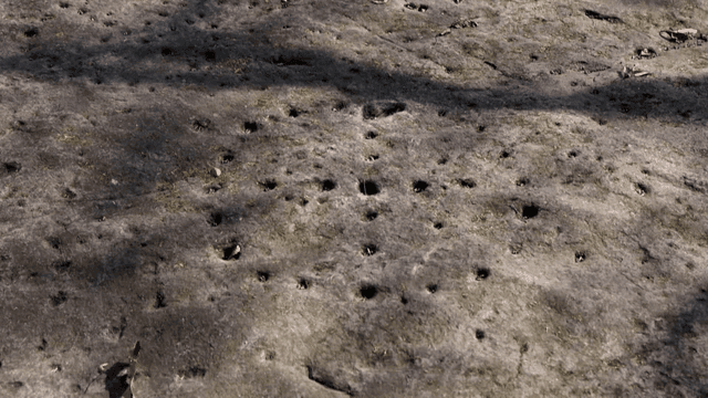 Rock surface with small holes and shadows