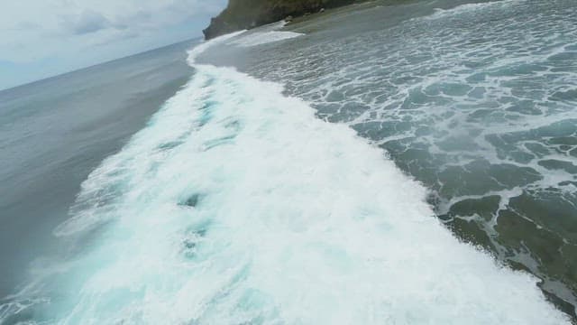 Waves crashing on a rocky shoreline