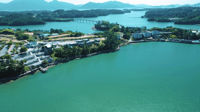 A scenic coastal village with lush greenery