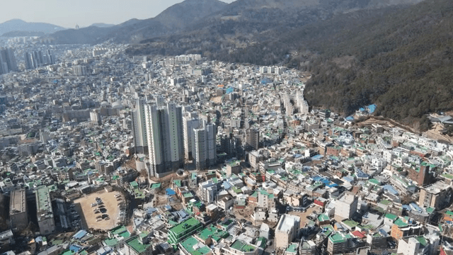 Colorful hillside village with mountains