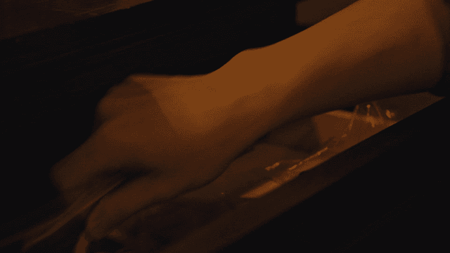 Hand taking from drawer an envelope-kept red whistle