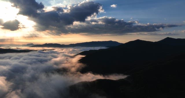 Mountain landscape with clouds at sunrise