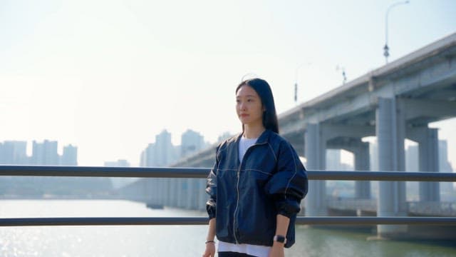 Woman adjusting her hair outdoors