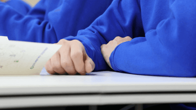 Students in blue clothes studying