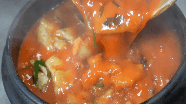 Spicy handmade dumplings poured from pot
