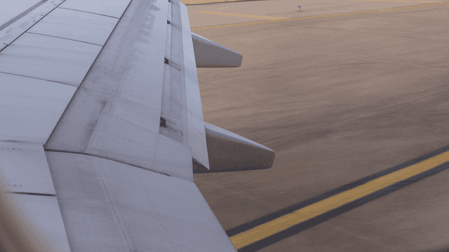 Airplane wing on the runway