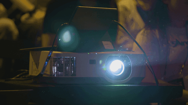 Projector displaying in a dimly lit room