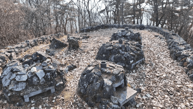 Pile of stones in autumn forest