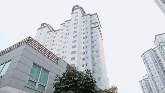 Tall apartment buildings under a clear sky