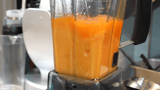 Blender for grinding fresh persimmons in kitchen