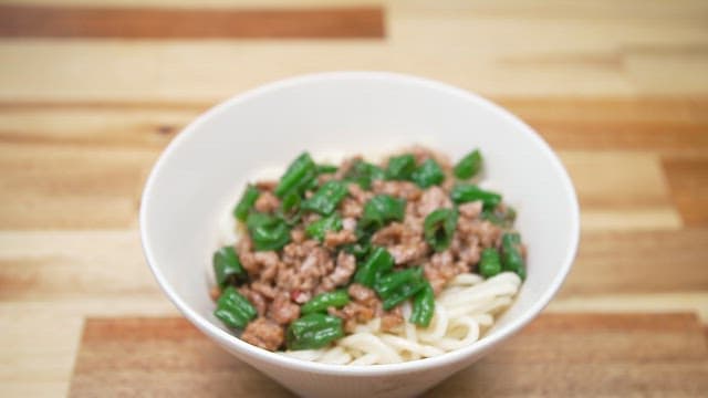 Delicious noodles with diced meat and chili peppers