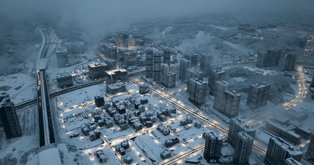 Snow-covered cityscape with buildings