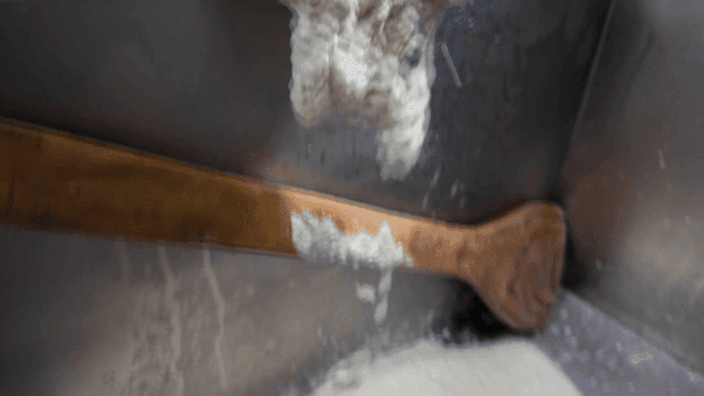 Soy milk falling into large container