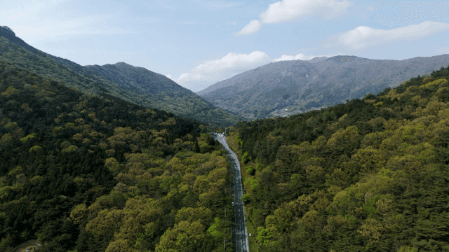 Road crossing blue mountains