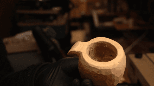 Craftsman carving a wooden object