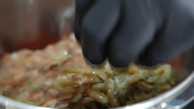 Shrimp being prepared in a metal bowl