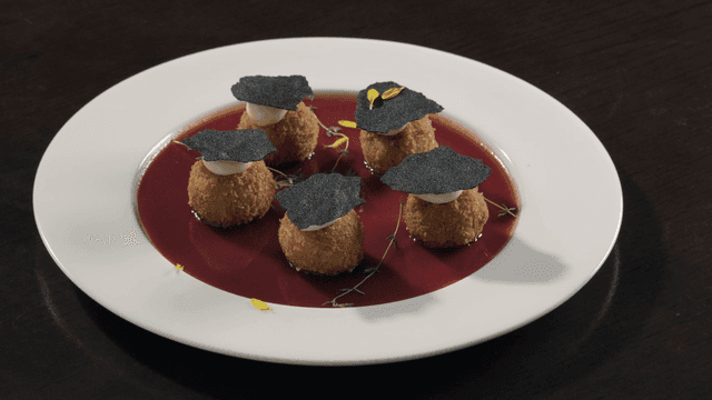 Fine dining restaurant dish topped with truffle