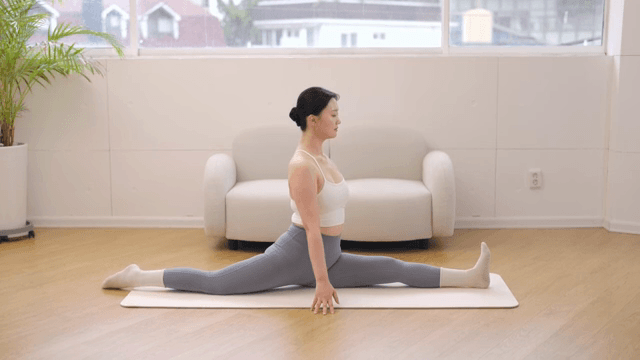 Woman practicing yoga indoors