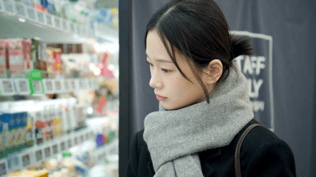 A woman shopping in a grocery store