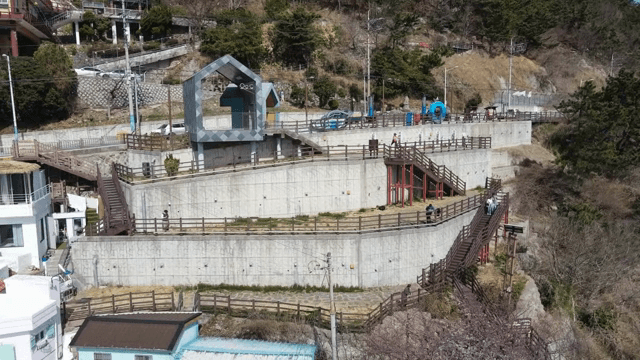 Hillside village area with pathways