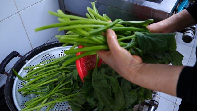 Preparing Fresh Greens in a Kitchen