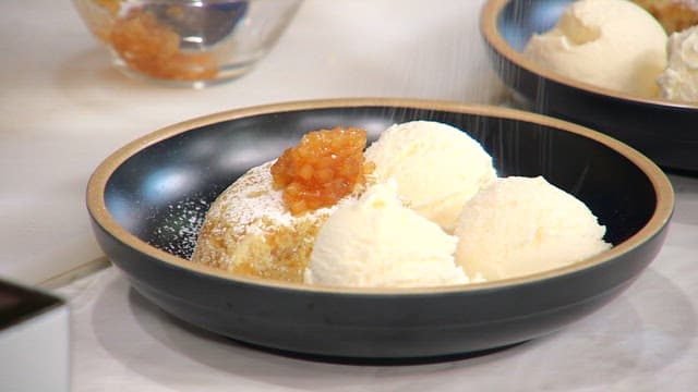 Plate of pancakes with ice cream and apple jam