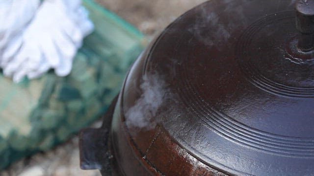 Steam rising from a traditional pot