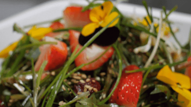 Seasoned vegetables topped with strawberries and flowers