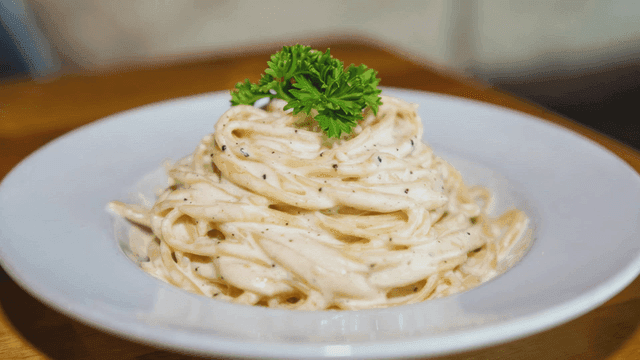 Creamy pasta garnished with parsley