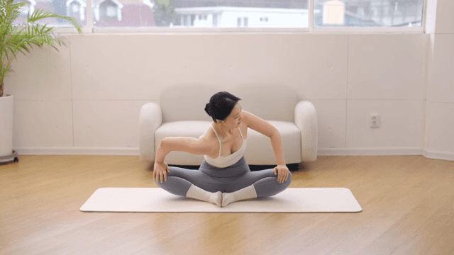 Woman practicing yoga indoors