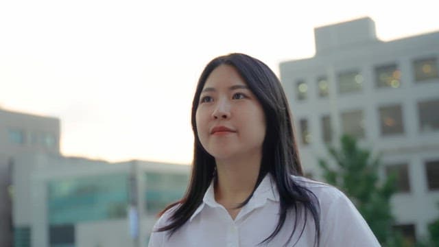 Woman looking up in an urban setting