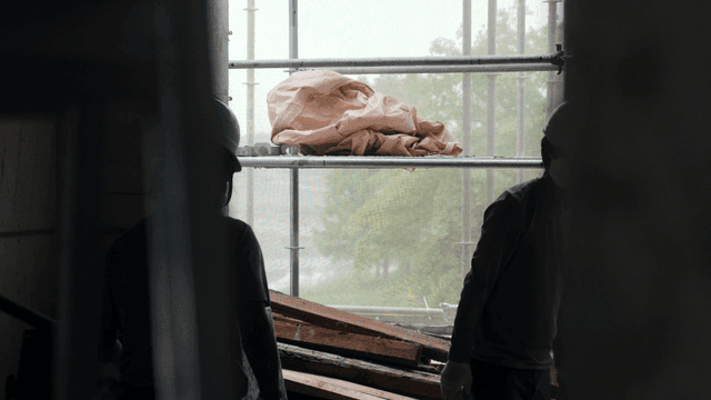 Construction workers inside a building