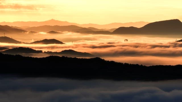 Mountains with clouds at sunrise