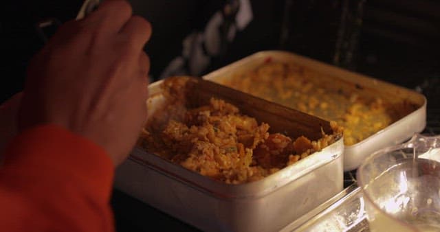 Person Enjoying a Meal in a Casual Setting