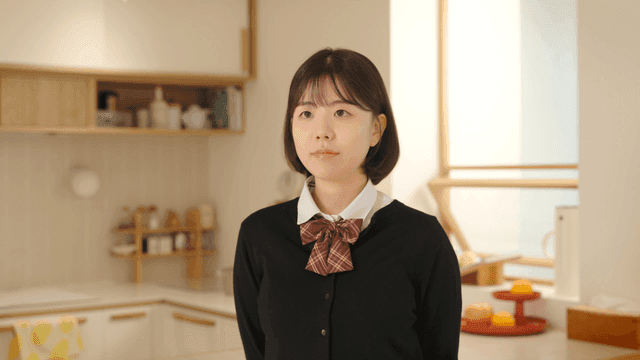 Schoolgirl standing at home
