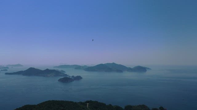 Calm sea and islands under the twilight sky