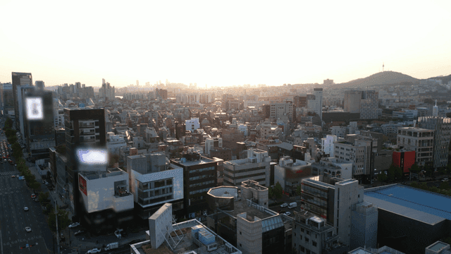 A bustling cityscape at sunset